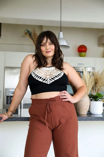 High-neck crochet black bralette with a lightweight and stretchy fit.