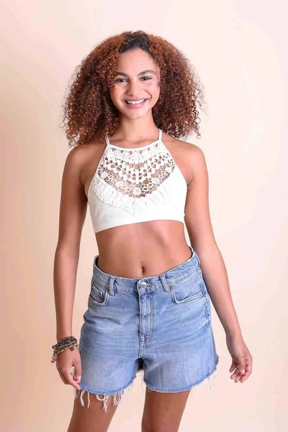 Lightweight halter crochet ivory bralette with cross-back straps.