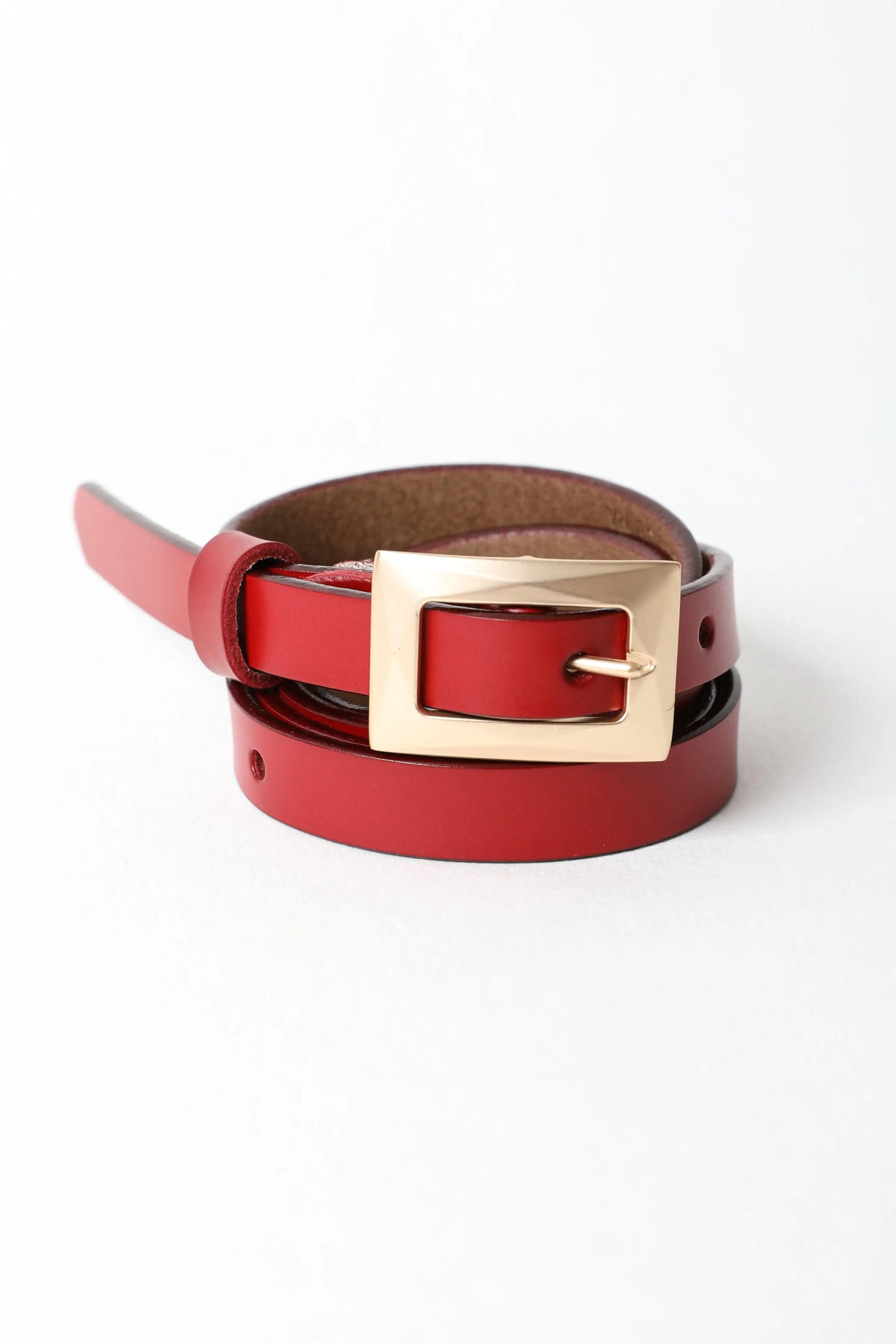 Slim waist red belt with gold buckle for versatile styles.